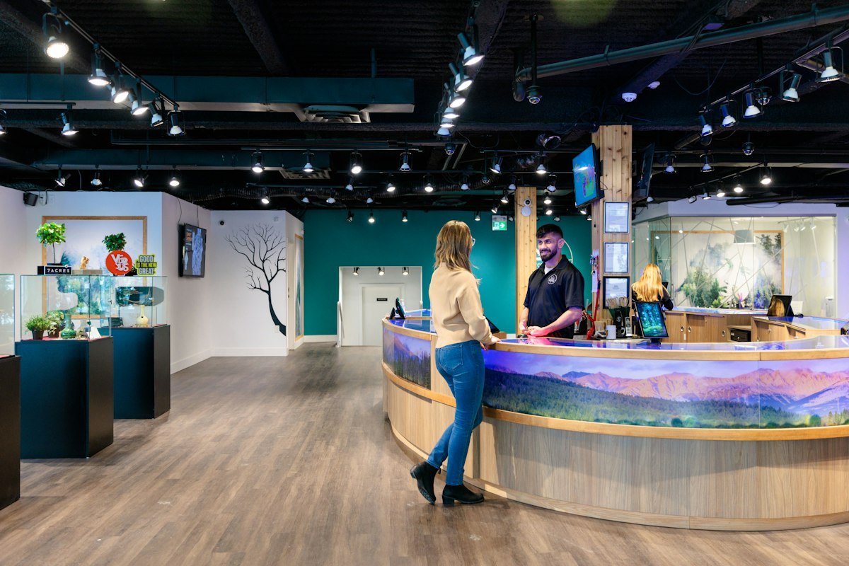 Bright dispensary interior with a round service counter